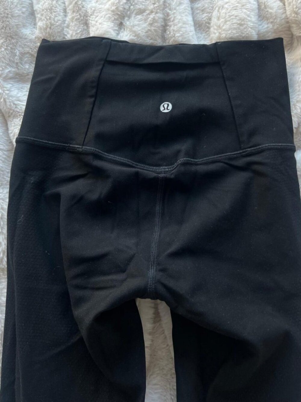 Lululemon black leggings with a super cute mesh design on the legs. No flaws!